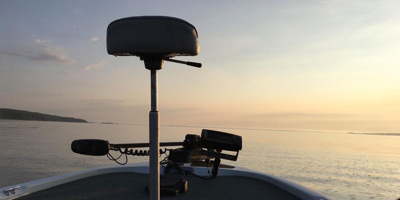 Matthew Randall fishing Georgian Bay in the morning, watching the sun rise.