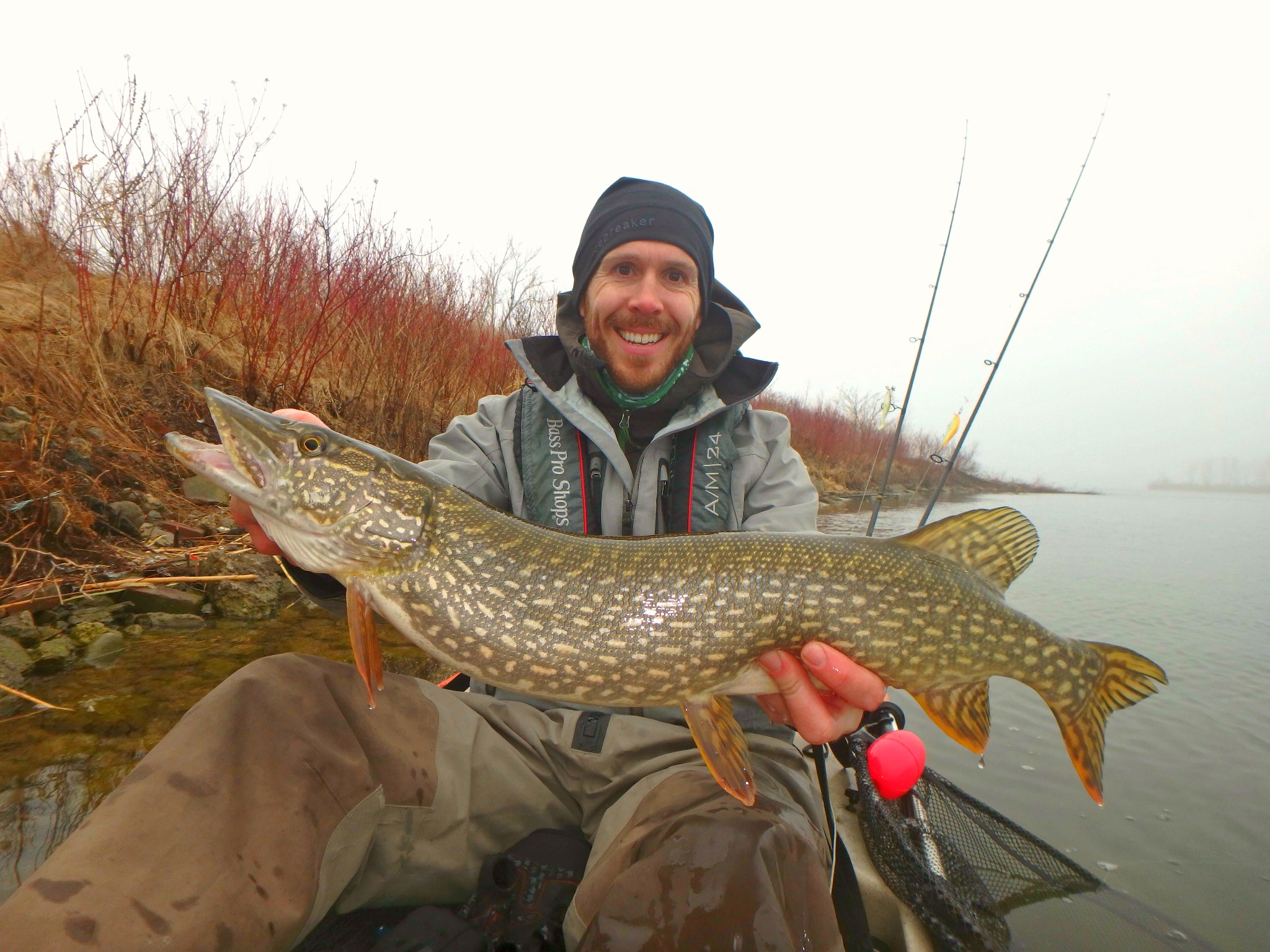 Matthew Randall holding a large pike