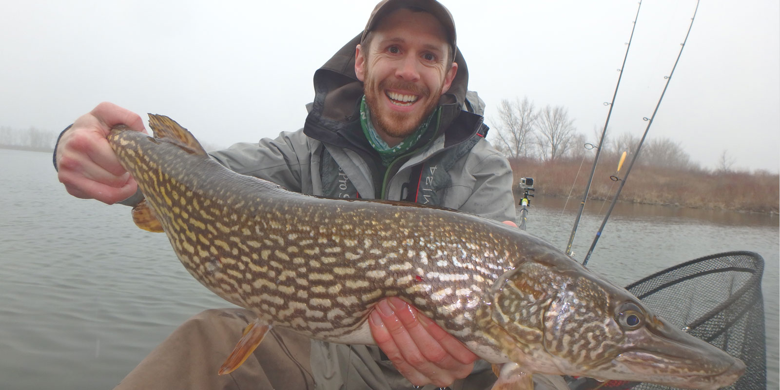 Matthew Randall holding a huge Pike in Tommy Thompson park.