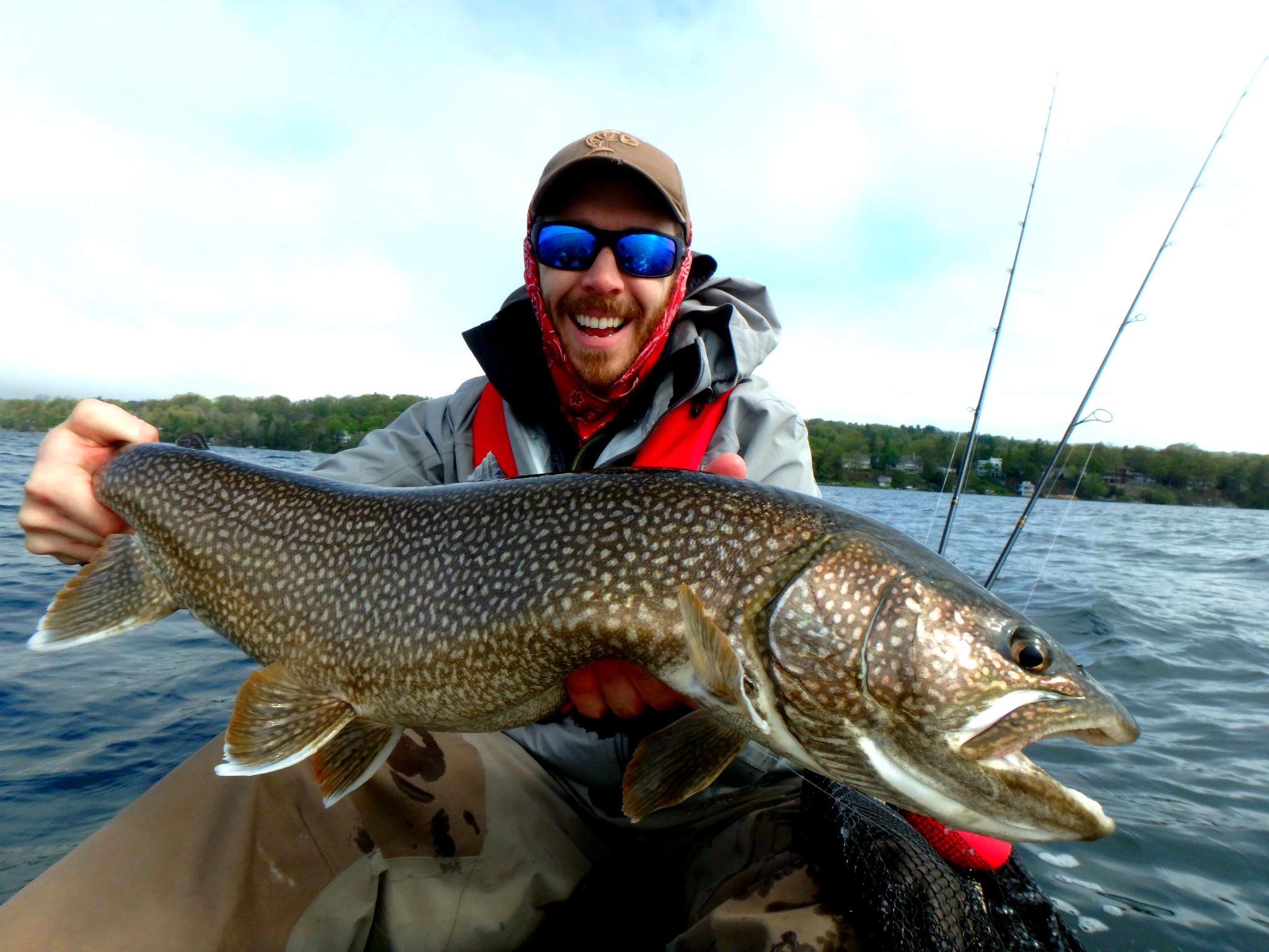 Matthew Randall holding a large Lake Trout