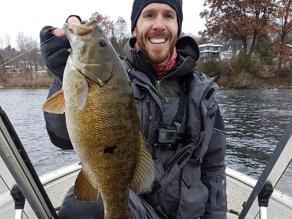 Matthew Randall with a large bass on lake Simcoe.