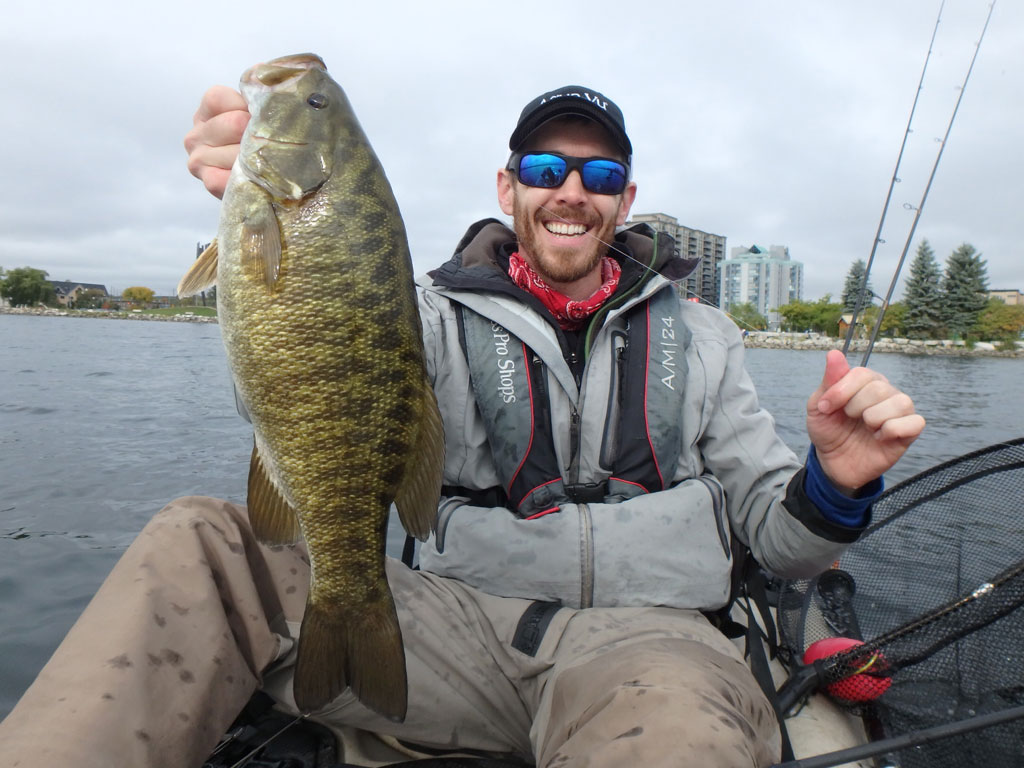 Matthew Randall with a large bass on lake Simcoe.