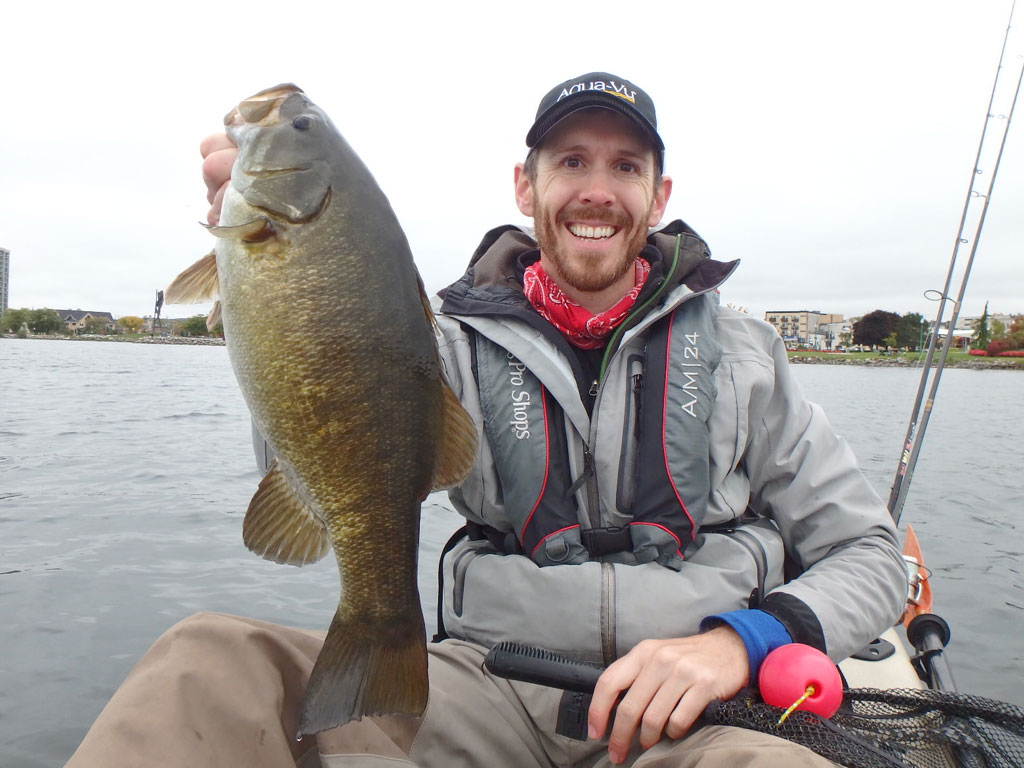 Matthew Randall with a large bass on lake Simcoe.