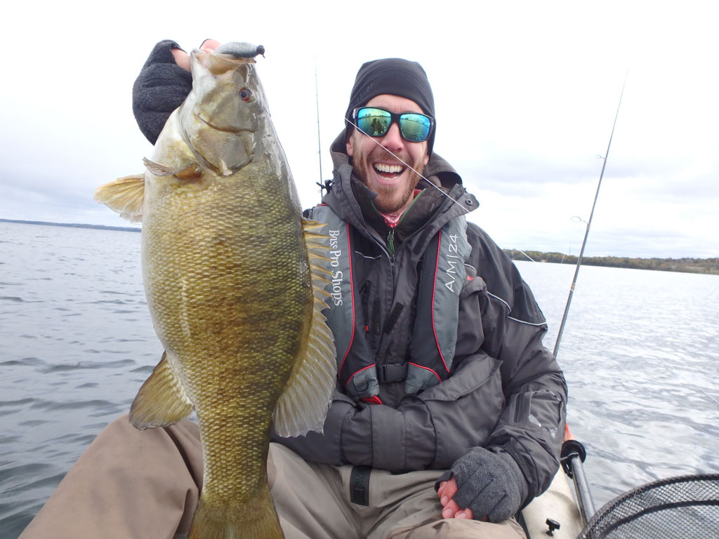 Matthew Randall with a large bass on lake Simcoe.