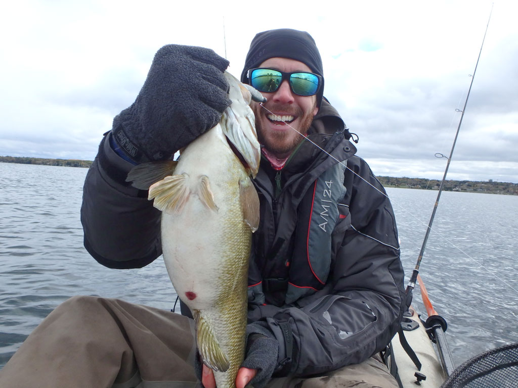 Matthew Randall with a large bass on lake Simcoe.