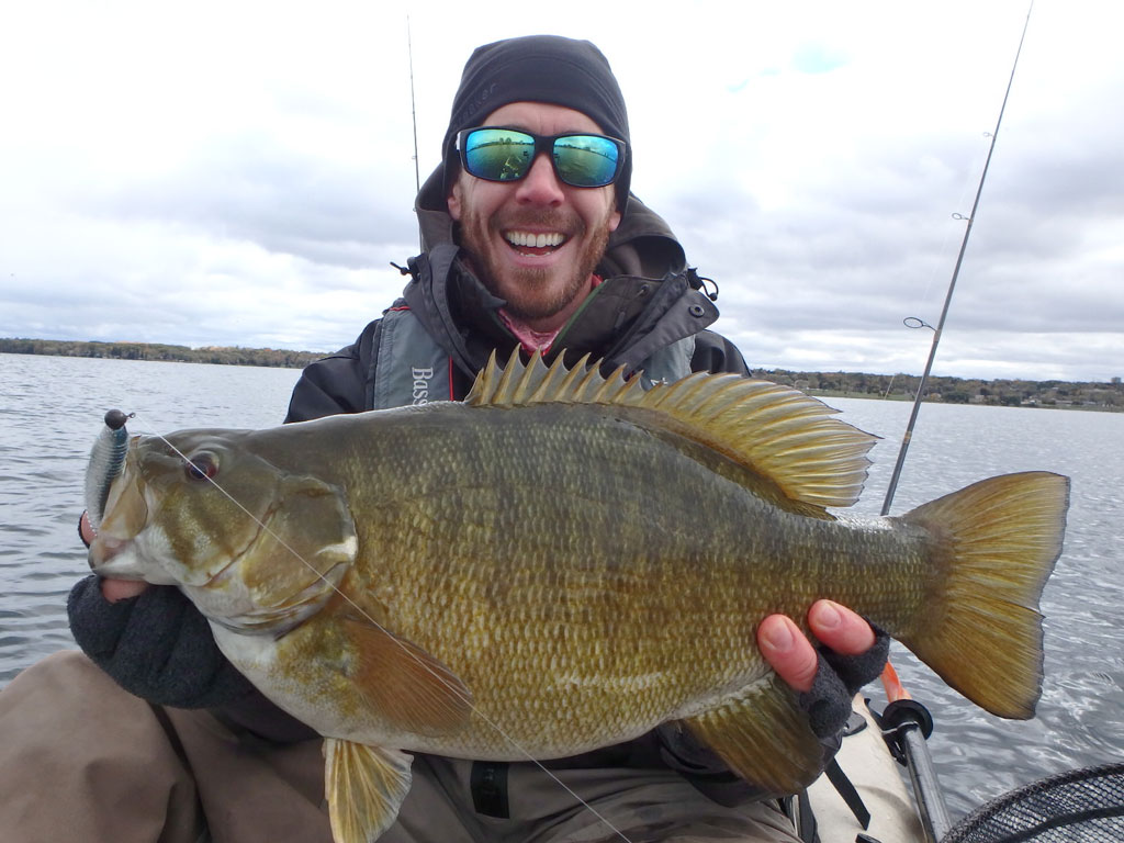 Matthew Randall with a large bass on lake Simcoe.