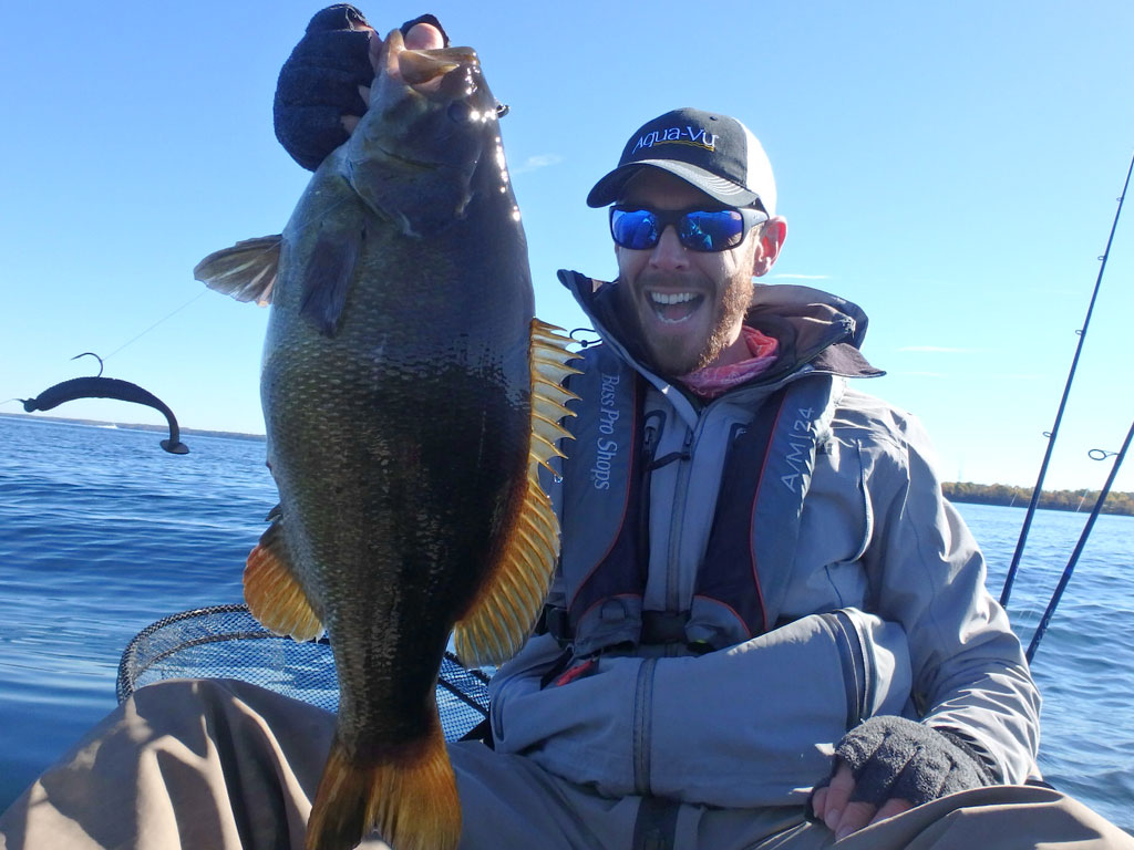 Matthew Randall with a large bass on lake Simcoe.