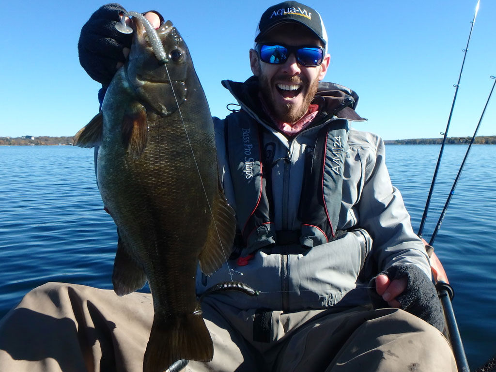 Matthew Randall with a large bass on lake Simcoe.