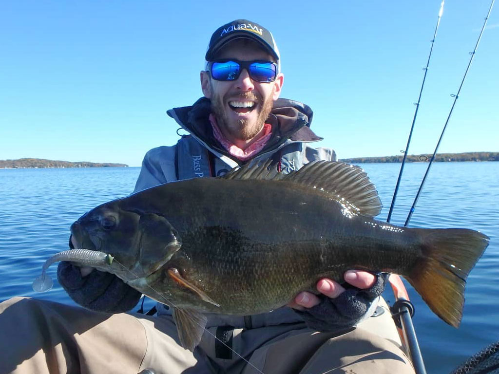 Matthew Randall with a large bass on lake Simcoe.