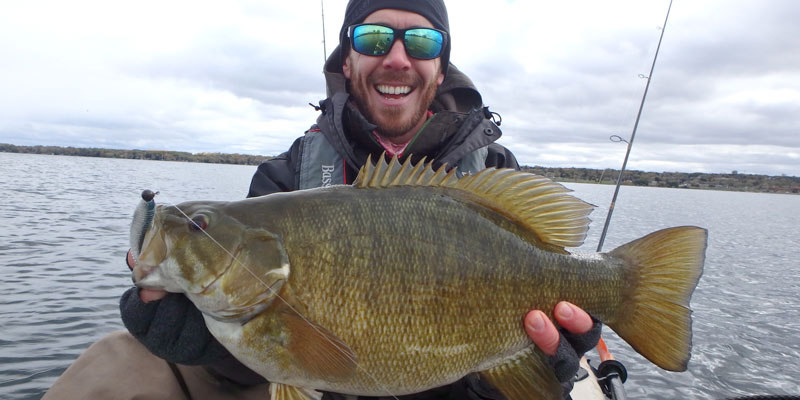 Matthew Randall holding a big bass from Simcoe.