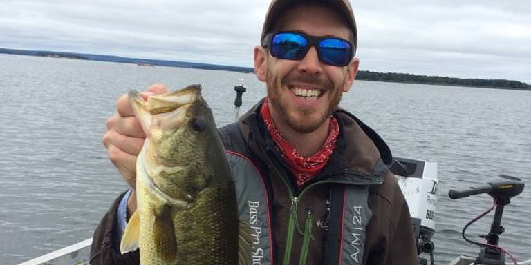 Matthew Randall holding a big largemouth bass.