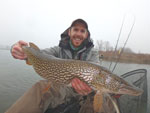 Matthew Randall holding a large Pike in the Toronto Islands.