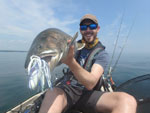 Matthew Randall holding a large Lake Trout on Lake Simcoe.