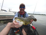 Matthew Randall's holding a bowfin, front shot.